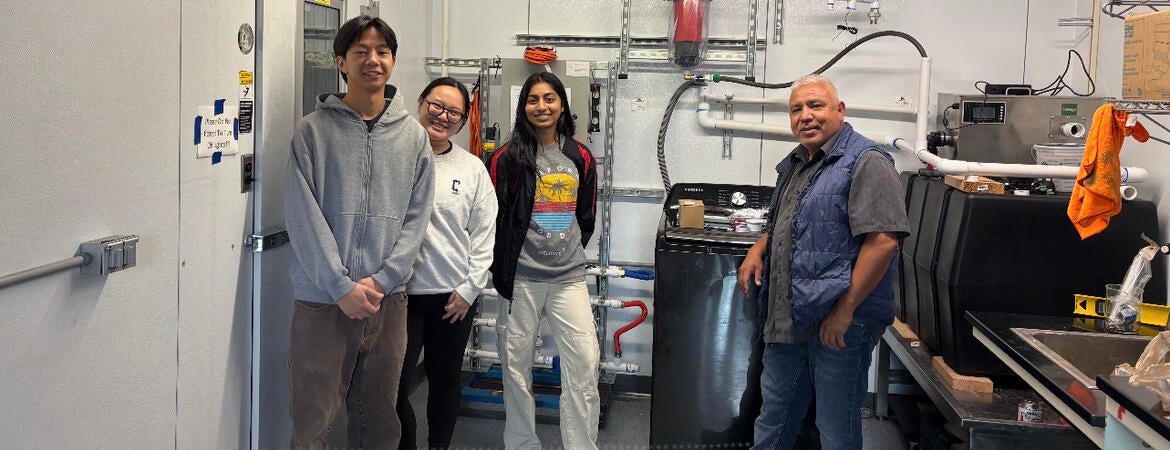 UCR engineering students worked alongside Laundry to Landscapes co-founder Miguel Cuellar to install the company's graywater filtration prototype, preparing the system for testing under real household laundry conditions.