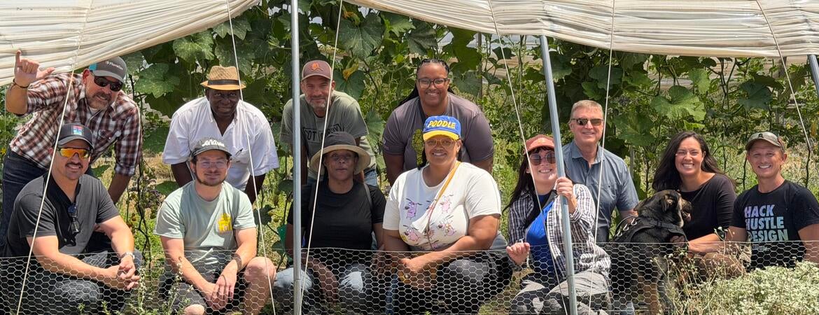 Students from UCR’s Seed to Scale Controlled Environment Agriculture (CEA) program pose with From the Land founders Dr. Gina Oliver and Richard Hutchison and instructor Dan Ovadya inside the wind tunnels at From the Land's farm during a field experience exploring agricultural innovation and entrepreneurship.