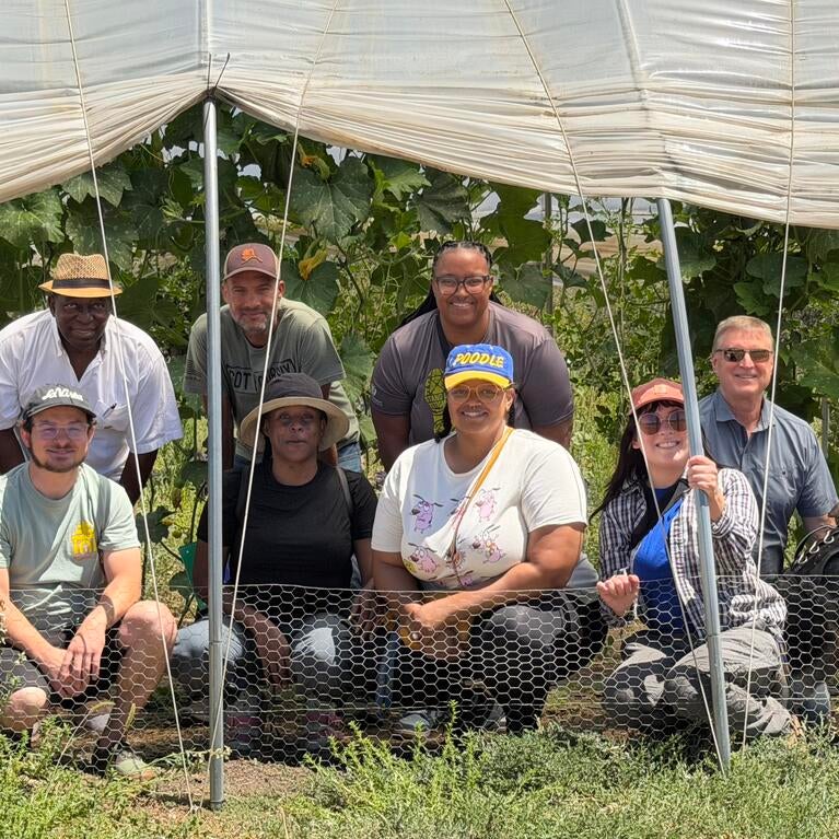 Students from UCR’s Seed to Scale Controlled Environment Agriculture (CEA) program pose with From the Land founders Dr. Gina Oliver and Richard Hutchison and instructor Dan Ovadya inside the wind tunnels at From the Land's farm during a field experience exploring agricultural innovation and entrepreneurship.
