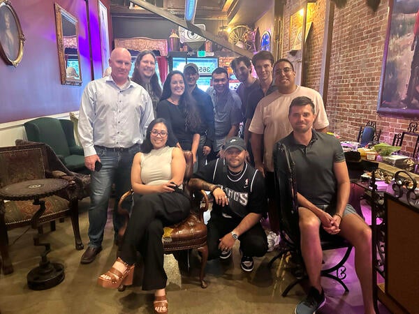 Group of startup founders smiling at a local restaurant for the Startup Social mixer