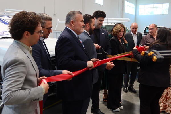 Voltu CEO George Gebhart cutting the ribbon alongside Riverside Mayor Patricia Lock-Dawson during the ribbon cutting ceremony at Voltu's new Riverside facility.