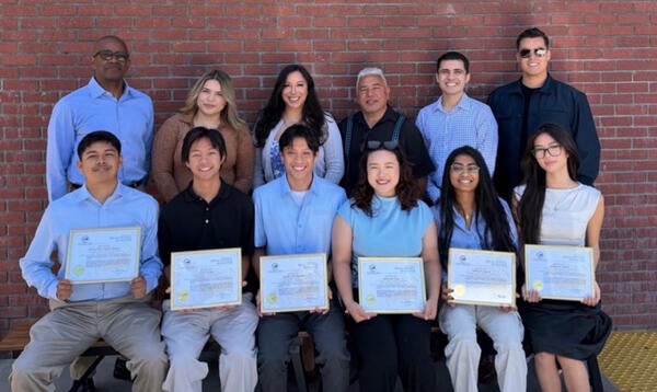 Laundry to Landscapes CEO Andrea Cuellar (back row, center) and co-founder Miguel Cuellar (back row, third from right) hosted an appreciation luncheon recognizing the UCR engineering capstone team, where students were presented with a Special Mayoral Recognition from the City of Moreno Valley. They were joined by UCR's Entrepreneur-in-Residence and business mentor Galen Williams (back row, left) and community partners to celebrate the students' contributions and connect them with professionals in fields ali