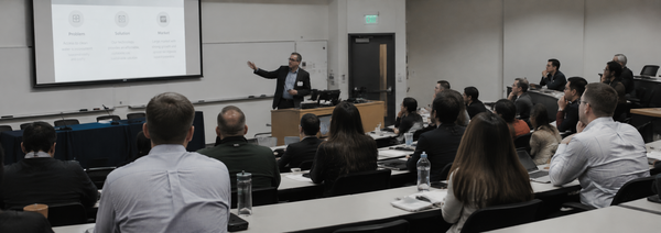 Instructor leads an SBIR/STTR workshop for technology entrepreneurs in a university classroom.